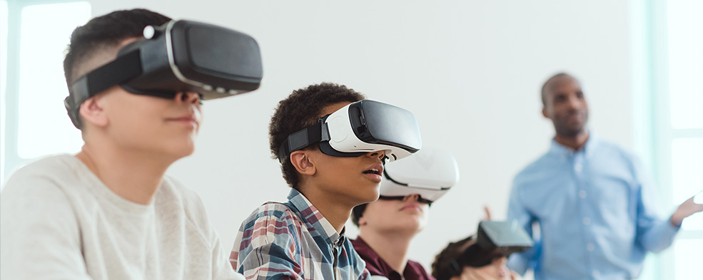 Kids wear VR googles and learn a virtual lesson from their teacher