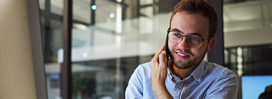 An employee makes a business call on their mobile phone, utilising SIP trunking technology.