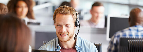 IT support employee wearing a telephone headset
